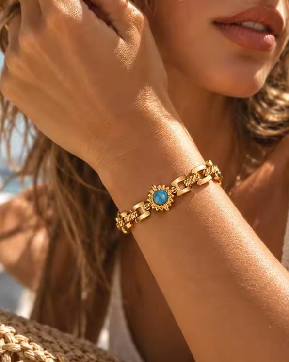 Avelyn 18K gold plated bracelet with blue stone worn on wrist — Alphenik UAE