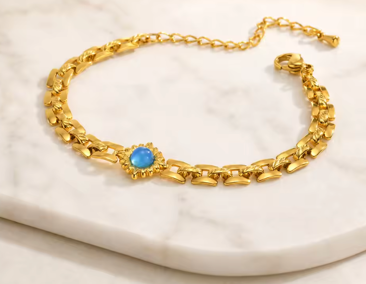 Avelyn 18K gold plated link bracelet with extender on marble — Alphenik UAE