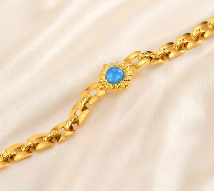 Avelyn gold bracelet blue sunburst stone close-up — Alphenik UAE