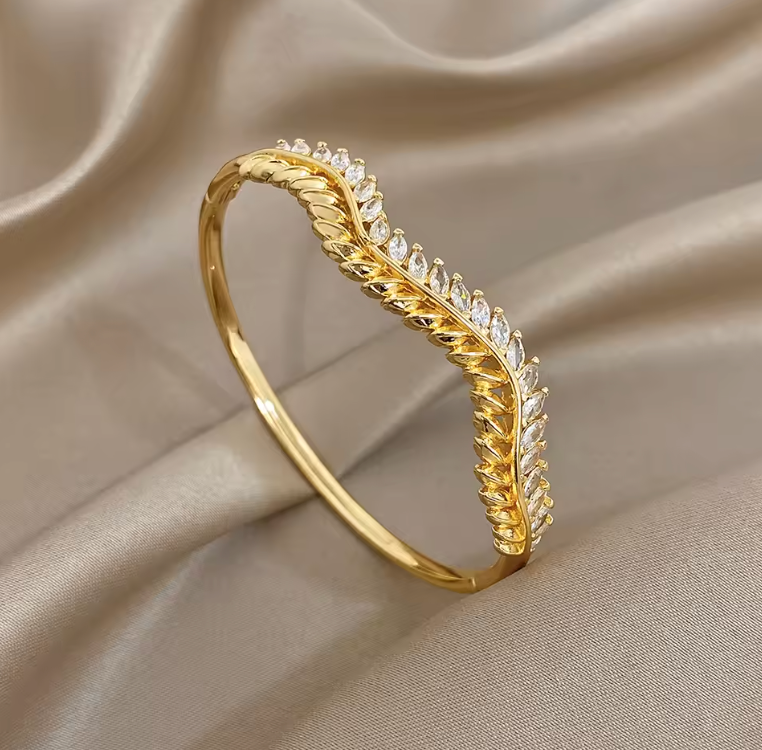 Elise 18K gold plated rhinestone bangle with wave design — Alphenik UAE